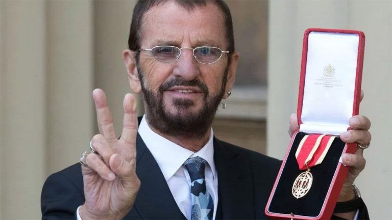 Ringo Starr, former drummer of The Beatles, posing with a medal following his knighthood