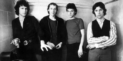 English rock band Dire Straits pictured in the '80s, with frontman Mark Knopfler, second from the left.