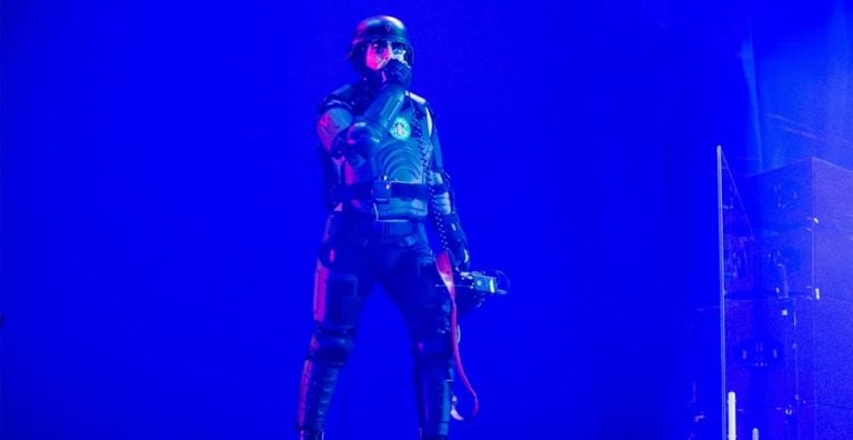 Tool's Maynard James Keenan performing in Texas while wearing riot gear