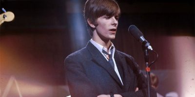 A young David Bowie performing live