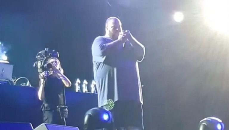 Action Bronson smoking onstage in Kosovo.