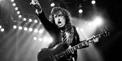 Angus Young of AC/DC playing guitar