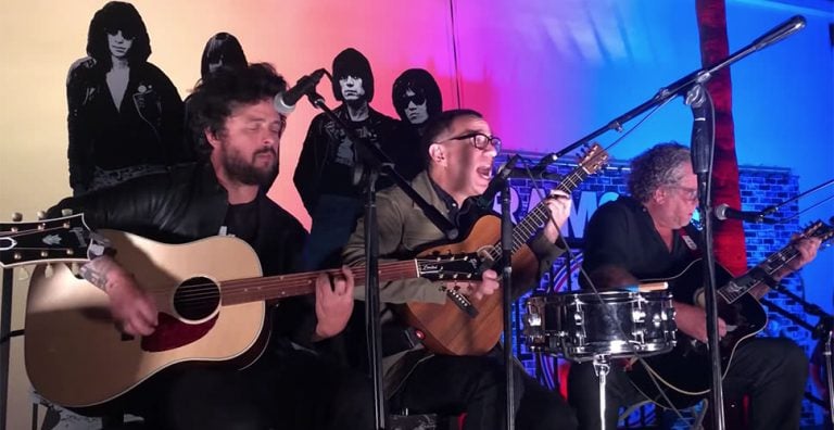 Billie Joe Armstrong, Fren Armisen, and Steve Jones taking part in a tribute to the Ramones' Johnny Ramone