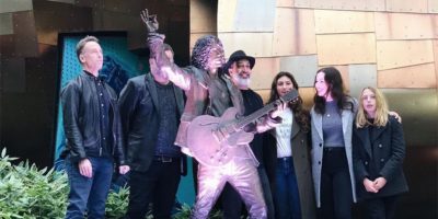 Seattle's Chris Cornell statue, flanked by his family members and Soundgarden bandmates