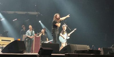 Foo Fighters' Dave Grohl onstage with a ten-year-old fan