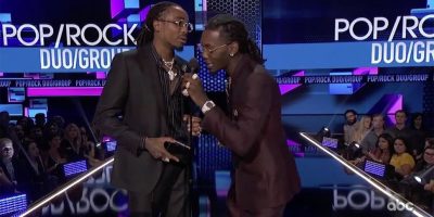 Members of Migos accepting their AMA Award