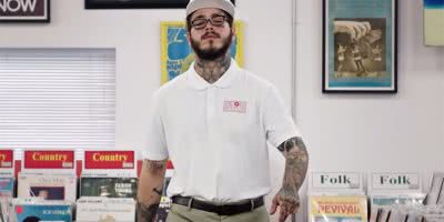 Post Malone dressed as a record store employee