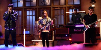 Travis Scott, Kevin Parker, and John Mayer performing on Saturday Night Live