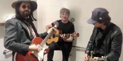 Eddie Vedder jamming out with Mike Campbell and Neil Finn