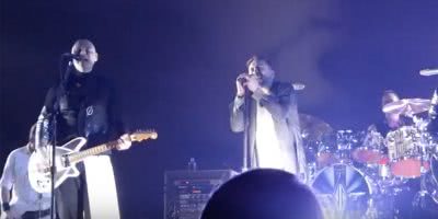 Image of The Smashing Pumpkins' Billy Corgan and Rise Against's Tim McIlrath performing onstage