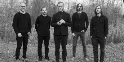 Members of US rock band The National in a forest.