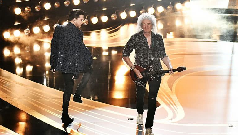 Adam Lambert and Brian May of Queen performing at the Oscars