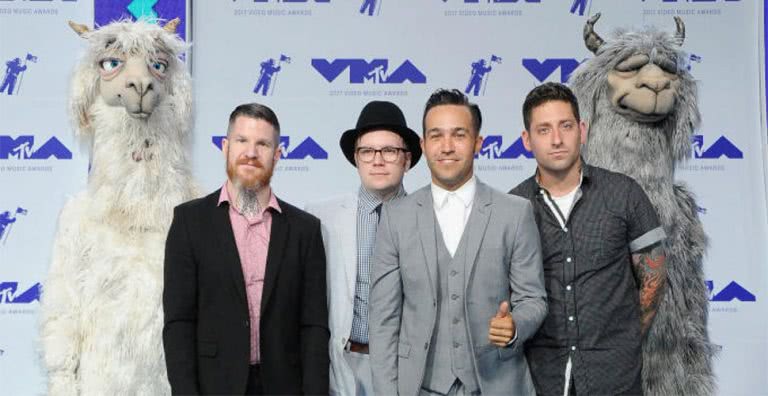 Fall Out Boy, pictured with the llama puppets they are being sued for