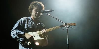 Matt Corby on stage at Margaret Court Arena in Melbourne.