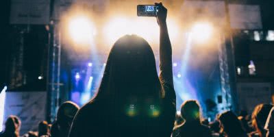 Image of people using their phones at a live show