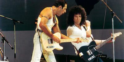 Freddie Mercury and Brian May of Queen performing at Live Aid in 1985