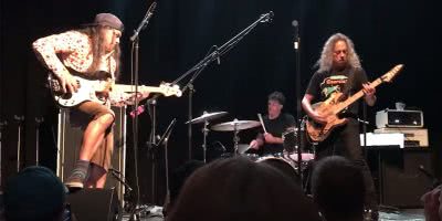 Kirk Hammett and Robert Trujilo of Metallica performing as part of The Wedding Band