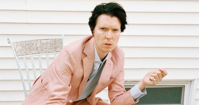 alex cameron press pic pink suit