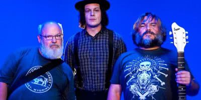 Photo of Jack Black and Kyle Gass of Tenacious D and Jack White against a blue backgtround