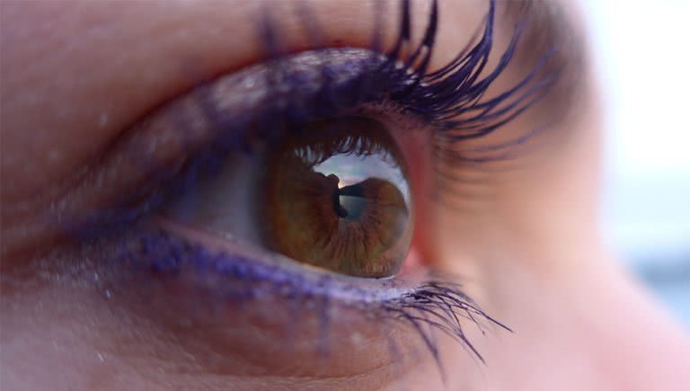 Image of a sunset being reflected via a person's eye