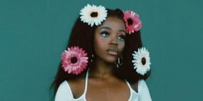 tkay maidza 2020 press shot flowers in hair