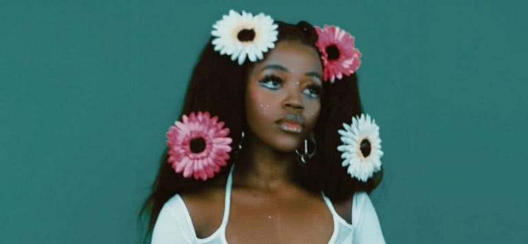 tkay maidza 2020 press shot flowers in hair