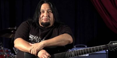 Fear Factory guitarist Dino Cazares holding a guitar