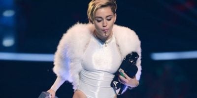 Musician Miley Cyrus smoking weed on stage