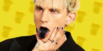 Machine Gun Kelly with a black tongue