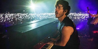 Morgan Evans behind a piano