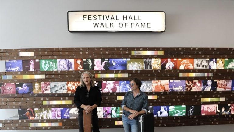 Powderfinger guitarists Darren Middleton and Ian Haug performed underground to promote the work on Brisbane's rail system