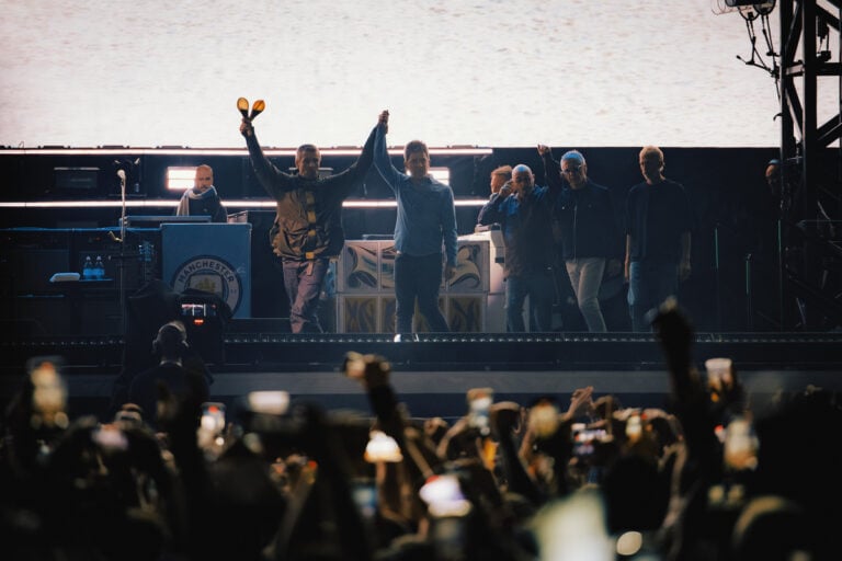 Oasis performing live in Cardiff, Wales
