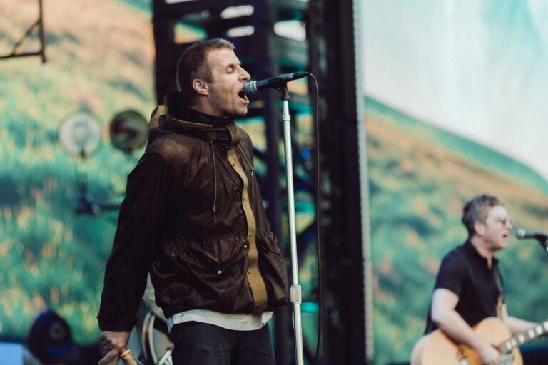 Oasis performing in Manchester