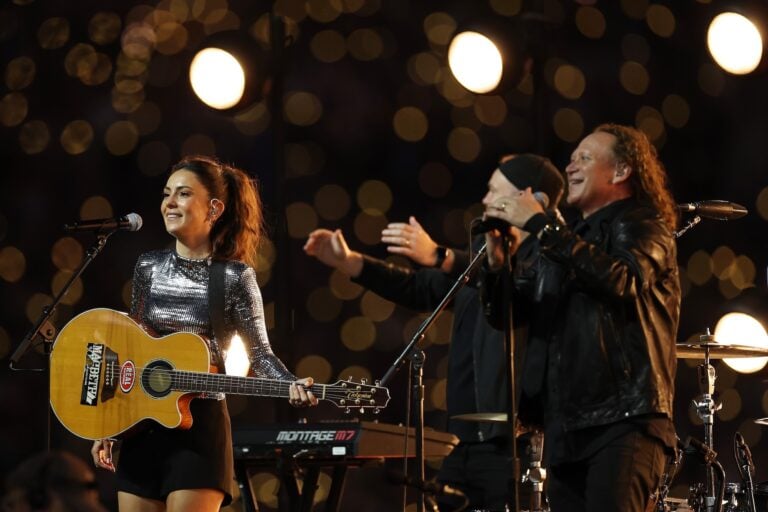 Amy Shark, Dave Gleeson and Phil Jamieson at the 2026 NRL Grand Final