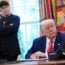 Elon Musk stands behind Donald Trump