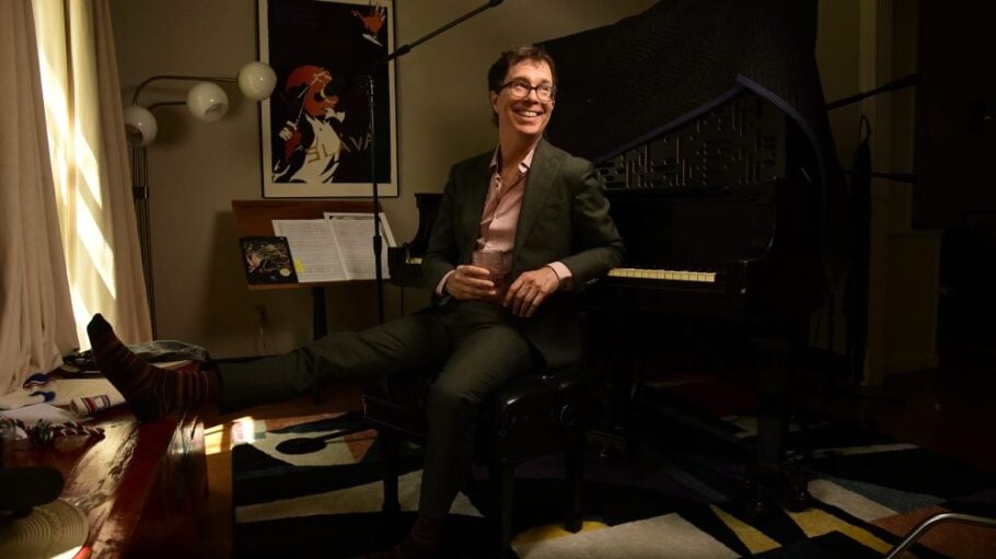Ben Folds smiling at a piano