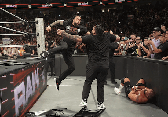 Roman Reigns hitting Bronson Reed