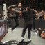 Roman Reigns hitting Bronson Reed