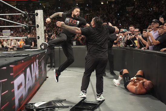 Roman Reigns hitting Bronson Reed