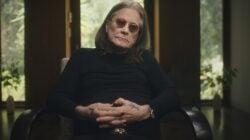 Ozzy Osbourne sitting in a chair