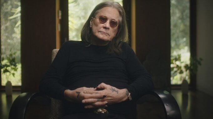Ozzy Osbourne sitting in a chair