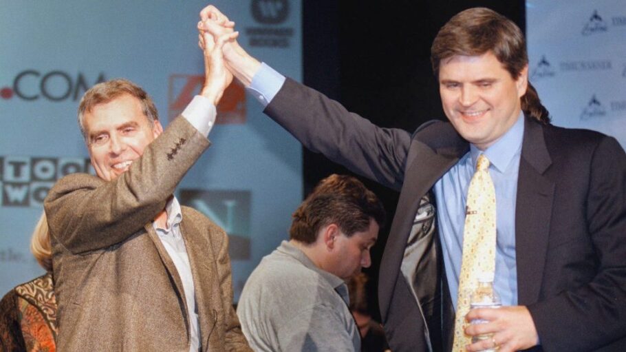 Two men hold hands at event